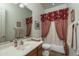 Clean bathroom with shower/tub combo and wood vanity at 11233 E Butherus Dr, Scottsdale, AZ 85255