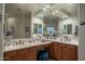 Double vanity bathroom with large mirror and plenty of counter space at 11233 E Butherus Dr, Scottsdale, AZ 85255