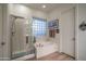Elegant bathroom with soaking tub and walk-in shower at 11233 E Butherus Dr, Scottsdale, AZ 85255