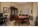 Formal dining room with wood table and hutch at 11233 E Butherus Dr, Scottsdale, AZ 85255