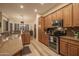 Well-equipped kitchen with stainless steel appliances and granite countertops at 11233 E Butherus Dr, Scottsdale, AZ 85255