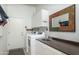 Laundry room with washer, dryer, and utility sink at 11233 E Butherus Dr, Scottsdale, AZ 85255