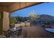 Outdoor kitchen and dining area with mountain views at 11233 E Butherus Dr, Scottsdale, AZ 85255