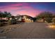 Luxury home exterior with a long driveway at 11440 E Winchcomb Dr, Scottsdale, AZ 85255