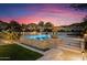 Stunning pool with a basketball hoop and lounge chairs at 11440 E Winchcomb Dr, Scottsdale, AZ 85255