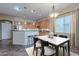 Kitchen with island and breakfast bar seating at 12702 W Dove Wing Way, Peoria, AZ 85383