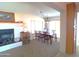 Dining room with wood table and chairs, adjacent to fireplace at 1344 E Victoria View St, Queen Valley, AZ 85118