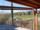 Covered patio overlooks a golf course and scenic mountains at 1344 E Victoria View St, Queen Valley, AZ 85118