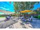 Backyard patio with seating and yellow umbrella at 13802 N 64Th Pl, Scottsdale, AZ 85254