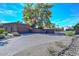 Brick driveway and garage with a large yard at 13802 N 64Th Pl, Scottsdale, AZ 85254