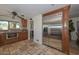 Kitchen boasts stainless steel appliances and ample wood cabinetry at 13802 N 64Th Pl, Scottsdale, AZ 85254