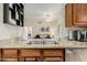 Kitchen sink with granite countertop and a view into the living room at 14950 W Mountain View Blvd # 6102, Surprise, AZ 85374