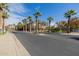 Community street view with palm trees and building at 14950 W Mountain View Blvd # 6102, Surprise, AZ 85374