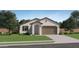 One-story home with a two-car garage and landscaped front yard at 15039 W Buckskin Trl, Surprise, AZ 85387