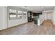 Modern kitchen with dark cabinetry, granite countertops, and stainless steel appliances at 17313 W Wandering Creek Rd, Goodyear, AZ 85338