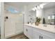 Double vanity bathroom with a large walk-in shower at 18087 W Sand Hills Dr, Surprise, AZ 85387