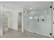 Sleek bathroom with a large walk-in shower and geometric tile at 18548 E Purple Sage Dr, Queen Creek, AZ 85142