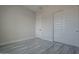 Spacious bedroom with double doors and gray tile floor at 22538 W Pecan Rd, Buckeye, AZ 85326