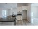 Modern kitchen features dark countertops and stainless steel appliances at 22538 W Pecan Rd, Buckeye, AZ 85326