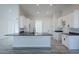 Spacious kitchen island with dark gray countertops and a modern sink at 22538 W Pecan Rd, Buckeye, AZ 85326