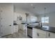 Large kitchen island with dark countertops and stainless steel appliances at 22538 W Pecan Rd, Buckeye, AZ 85326