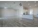 Open concept kitchen boasts modern cabinetry, sleek countertops, and an island at 22538 W Pecan Rd, Buckeye, AZ 85326