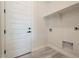 Bright laundry room with built-in shelving at 22538 W Pecan Rd, Buckeye, AZ 85326