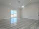 Open concept living area with tile floors and access to patio at 22538 W Pecan Rd, Buckeye, AZ 85326