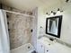Clean bathroom with shower/tub combo, tile surround, and vanity with sink at 305 S Val Vista Dr # 204, Mesa, AZ 85204