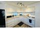Bright kitchen with white cabinets and gas range at 305 S Val Vista Dr # 204, Mesa, AZ 85204