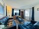 Living room with dark leather couches and wood-look floors at 305 S Val Vista Dr # 204, Mesa, AZ 85204