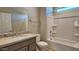 Clean bathroom with granite countertop, bathtub, and shower at 5625 W Bullhead Rd, Eloy, AZ 85131