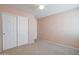 Bedroom with double door closet and ceiling fan at 5659 S 239Th Dr, Buckeye, AZ 85326
