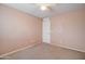 Light peach bedroom with ceiling fan and closet at 5659 S 239Th Dr, Buckeye, AZ 85326