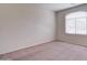 Simple bedroom with carpeted floors and window coverings at 5659 S 239Th Dr, Buckeye, AZ 85326