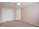 Bedroom with double door closet and ceiling fan at 5659 S 239Th Dr, Buckeye, AZ 85326