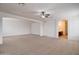 Large bedroom with ceiling fan and en-suite bathroom access at 5659 S 239Th Dr, Buckeye, AZ 85326