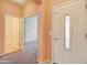 Bright entryway with neutral colored walls and carpet at 5659 S 239Th Dr, Buckeye, AZ 85326