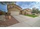 Two story house with a large yard and attached garage at 5659 S 239Th Dr, Buckeye, AZ 85326