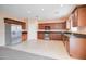 Modern kitchen with stainless steel appliances and ample cabinetry at 5659 S 239Th Dr, Buckeye, AZ 85326