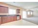 Kitchen with stainless steel appliances and access to Gathering room at 5659 S 239Th Dr, Buckeye, AZ 85326