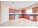 Well-equipped kitchen featuring wood cabinets and granite countertops at 5659 S 239Th Dr, Buckeye, AZ 85326