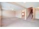 Bright living room featuring a staircase and open concept at 5659 S 239Th Dr, Buckeye, AZ 85326