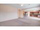 Open concept living room with kitchen and stairs at 5659 S 239Th Dr, Buckeye, AZ 85326