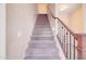 Staircase with a metal railing leading upstairs at 5659 S 239Th Dr, Buckeye, AZ 85326