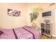 Guest bedroom with a twin bed and built-in shelving at 6722 W Piute Ave, Glendale, AZ 85308