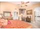 Main bedroom with a king-size bed and built-in wine rack at 6722 W Piute Ave, Glendale, AZ 85308