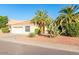 House exterior showcasing a two-car garage and palm trees at 6722 W Piute Ave, Glendale, AZ 85308
