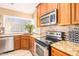 Kitchen with granite countertops and stainless steel appliances at 6722 W Piute Ave, Glendale, AZ 85308
