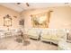 Living room featuring ornate furniture, a tapestry, and decorative accents at 6722 W Piute Ave, Glendale, AZ 85308